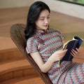A beige base color with zigzag stripes in red, blue and brown|Modern one-Pieces Qipao Dress（倾黛）